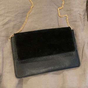 Women’s black clutch purse worn twice